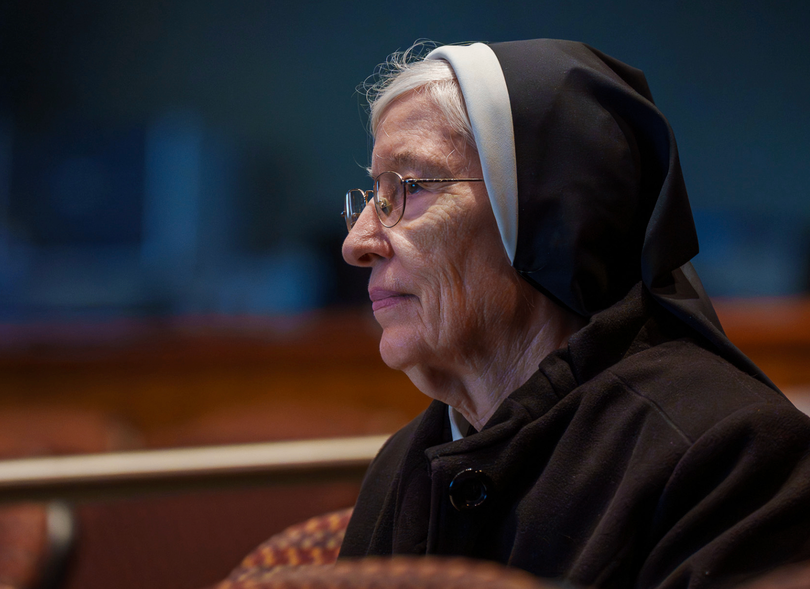 Close portrait of an attendee in religious habit at the summit