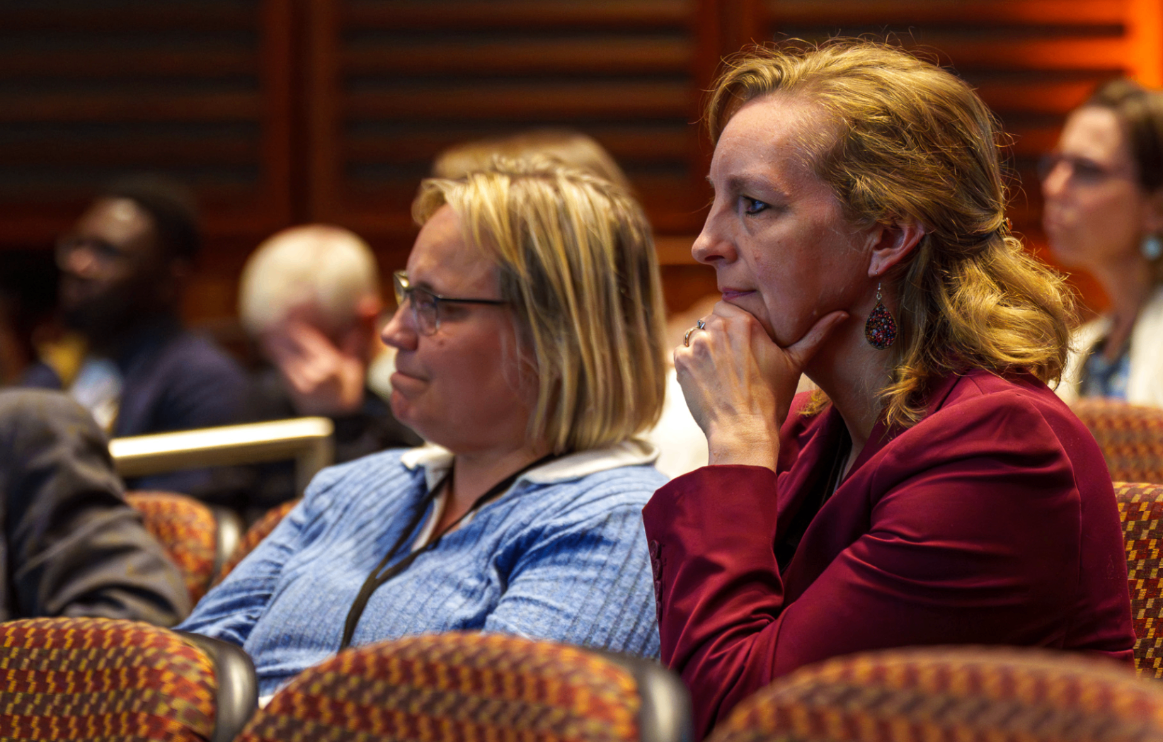 Attendees listening closely during a keynote session