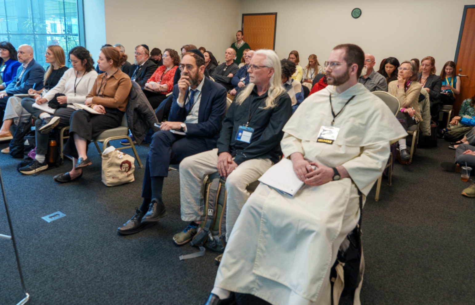 Audience seated during a summit session